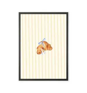 Kitchen wall art featuring a croissant design