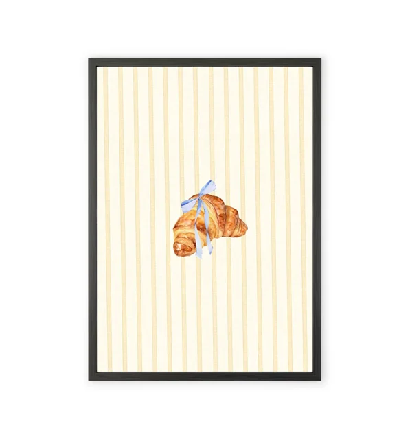 Kitchen wall art featuring a croissant design